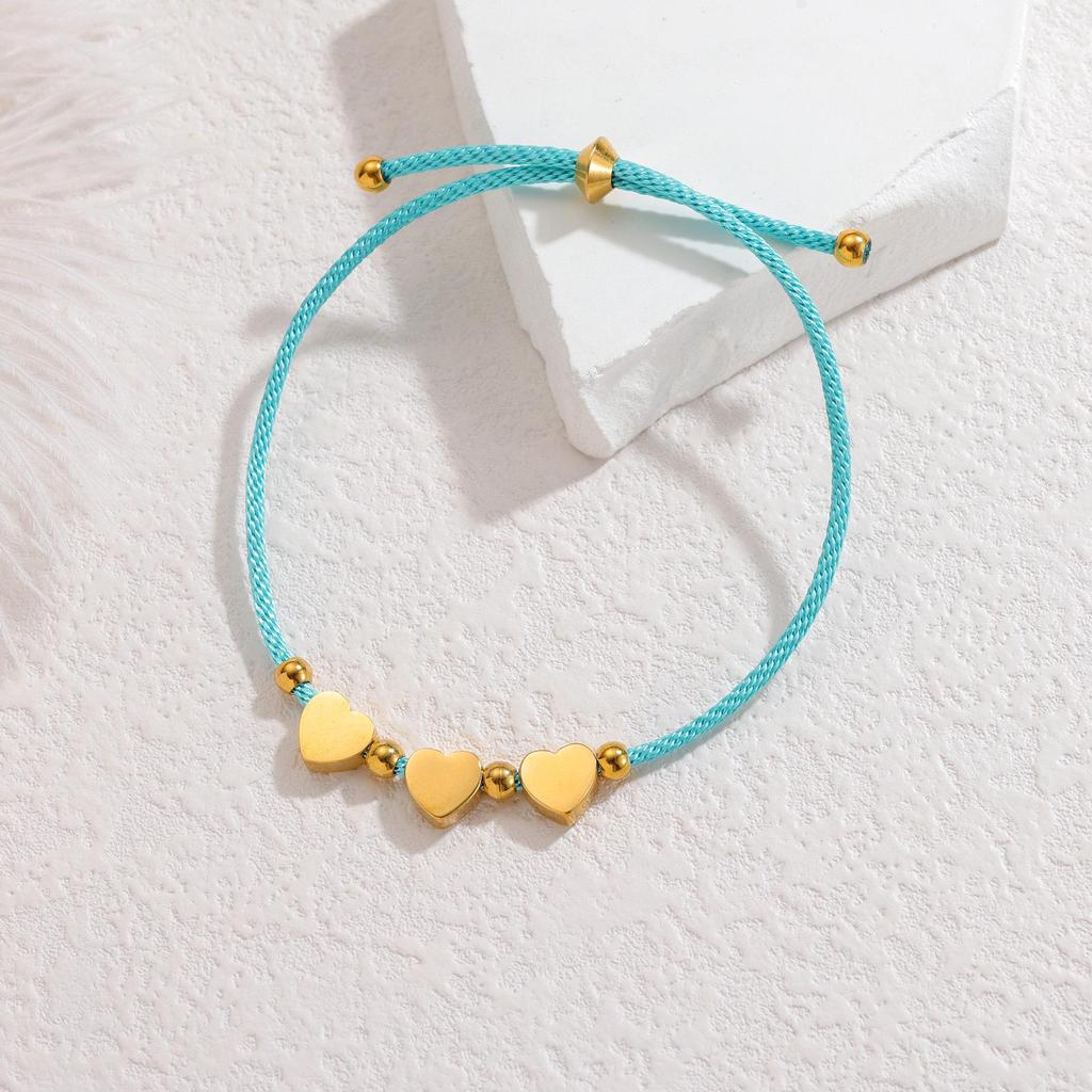 Minimalistisches blaues Seilarmband mit Herz-, Männchen- und runden Anhängern aus Edelstahl
