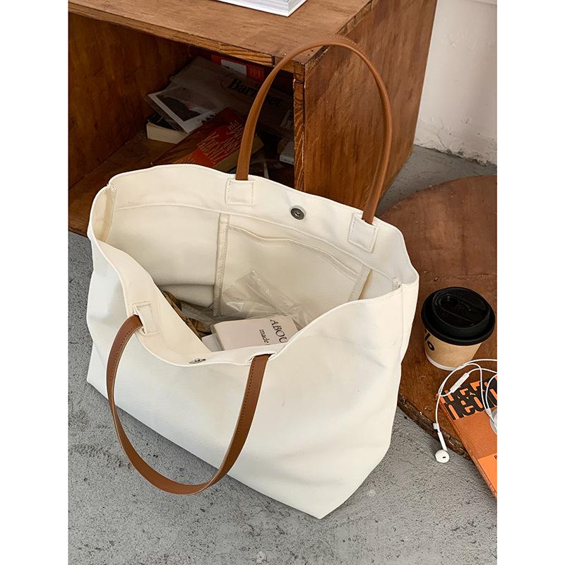 

Casual large-capacity bag women s 2025 new simple canvas bag versatile shoulder commuter tote bag, one piece is sent on behalf of others. бежевый
