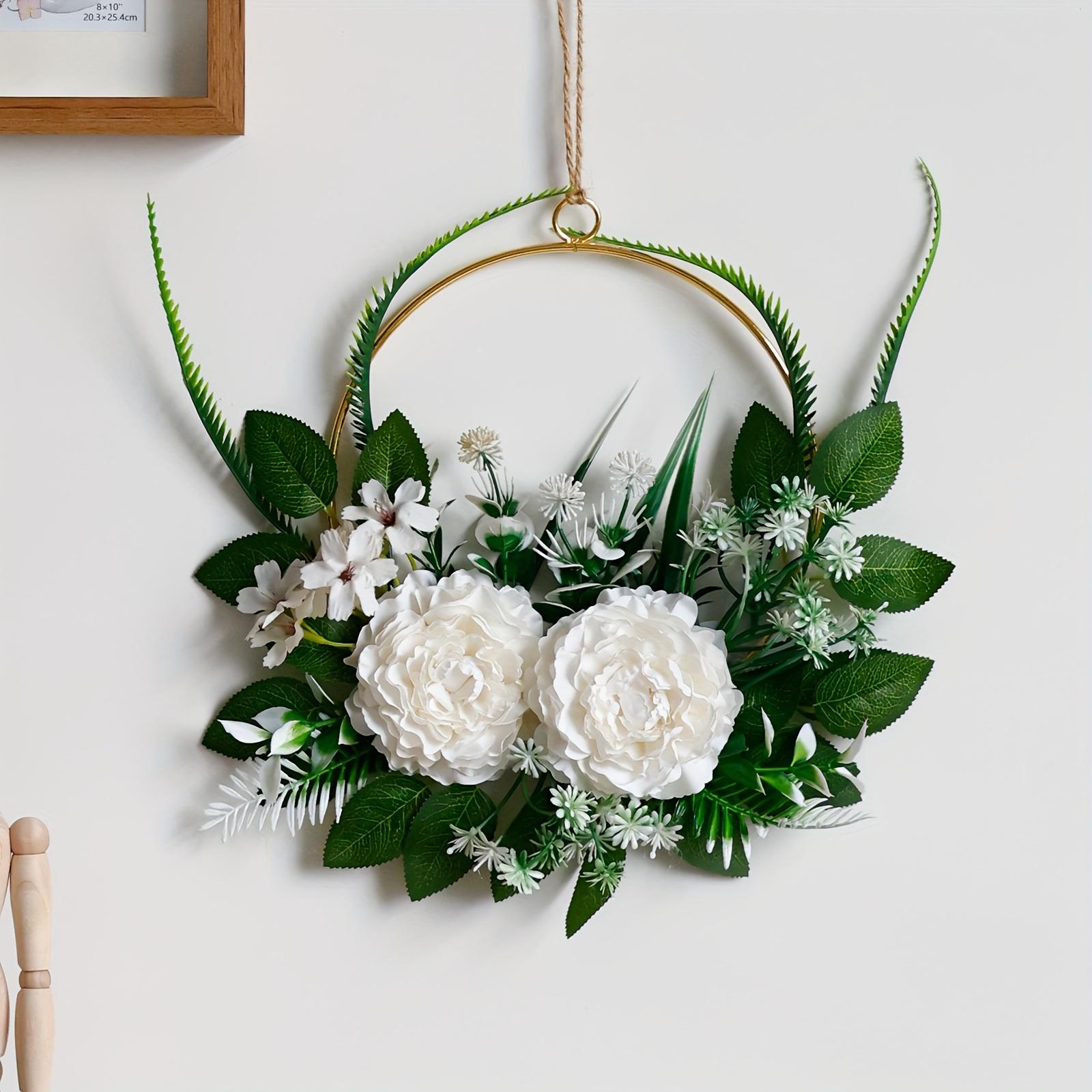 

White Rose Wreath with Golden Accents. Elegant floral wall decor for home, garden, and holiday celebrations. Shop now!