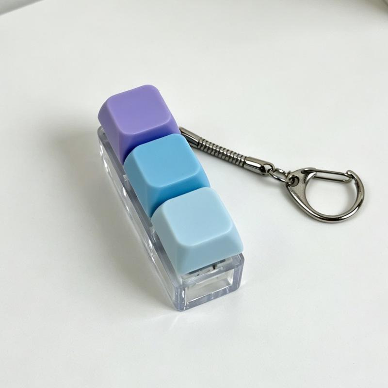 Sleutelhanger voor stressverlichting: Decompressie Kubus met Vier Knoppen & Toetsenbord Hanger