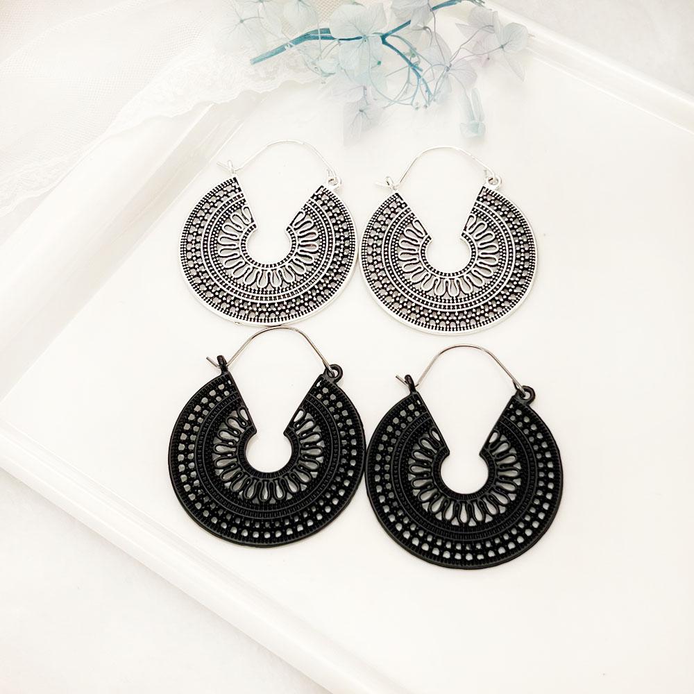 SIMJOO Boho-Stil hohle runde Ohrringe Damen Europäischer und Amerikanischer Ins-Stil Legierung hohl geschnitzte Ohrringe Nationalwind-Ohrringe