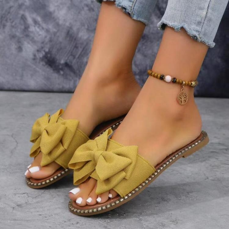 New flat-bottomed rhinestone bow one-word slippers for women to wear solid color light cloth cool slippers 2025