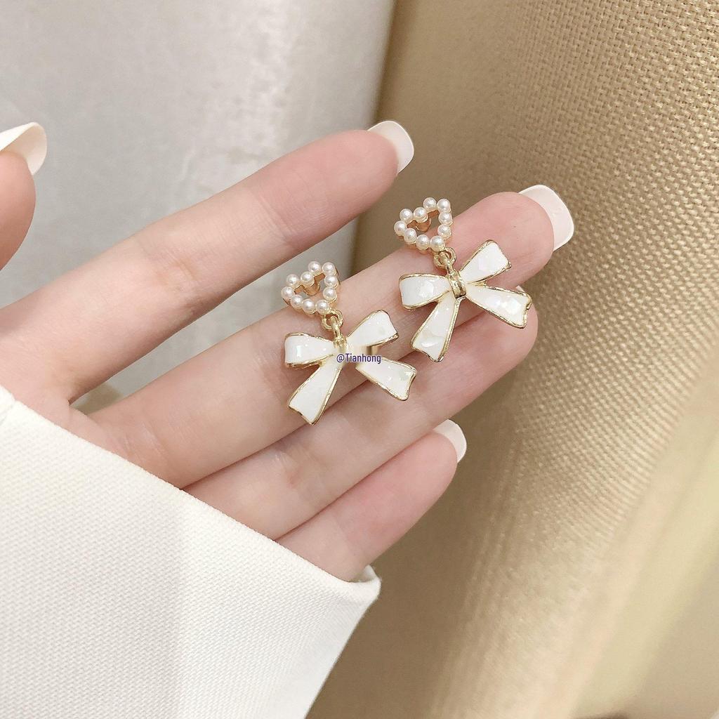 2025 Pearl Bow Stud Earrings: Trendy Minority Design for Women - Ear Clips & Accessories