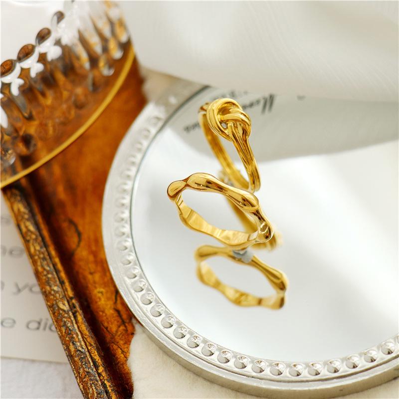 French Designer Titanium Steel Knotted Rope Ring for Women - Fashionable Simple Metal Jewelry