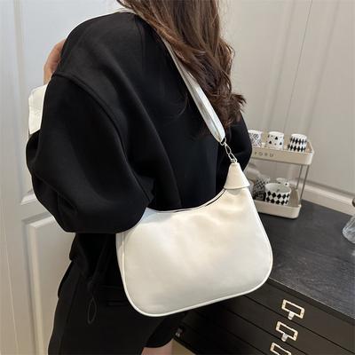 Bolsa de axila com textura retrô de nicho, nova, moderna, versátil, em couro macio, para通勤, de ombro único, transversal, tipo dumpling
