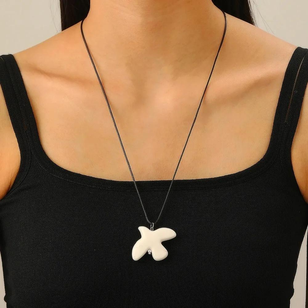 

European and American Fever Same Style White Ceramic Peace Necklace with Black Cord Design Long Sweater Chain Accessory