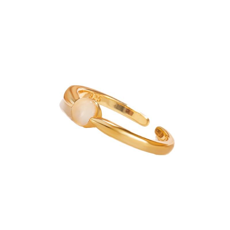 Elegant 2025 Ice-Transparent Egg-Shaped Women's Ring: Versatile, High-End Light Luxury Design with Open Gold Detail.