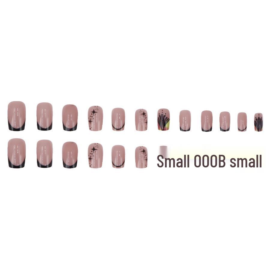 Ongles portables tendance noir et doré de longueur moyenne, style chic français unique