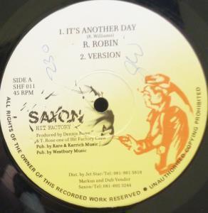 

12-дюймовая пластинка ROGER ROBIN - Это другой день / Катастрофа SHF011 Saxon Hit Facto UK Регги, Ска и Даб Б/У