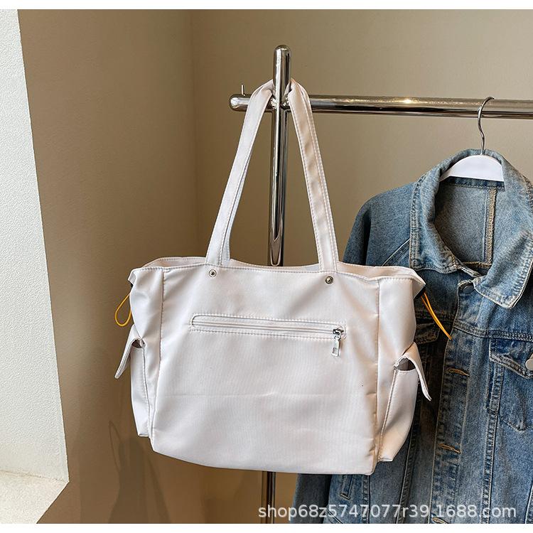 

Japanese commuter large-capacity canvas tote bag handbag bag women s underarm bag 2025 new trendy simple tote bag