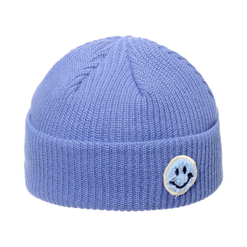 Autumn and winter wool hat male trend Japanese and Korean yuppie knitted warm smiley face sticker landlord hat candy color melon fur hat female
