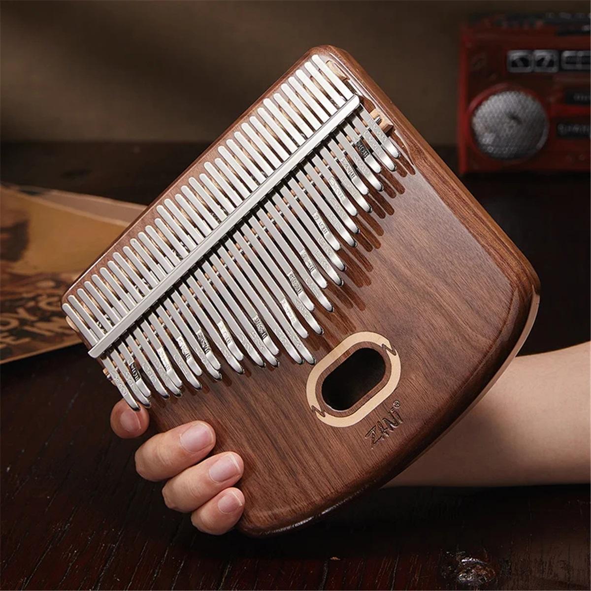 Piano à pouces 34 tons Piano à doigts professionnel Kalimba pour débutants Mini Créatif Cadeaux de vacances Instruments à clavier musicaux Style E