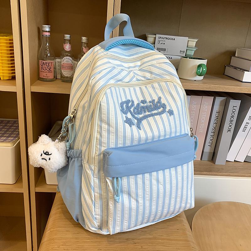 New high-value, fresh and sweet candy-colored striped backpack, high school student large-capacity backpack.
