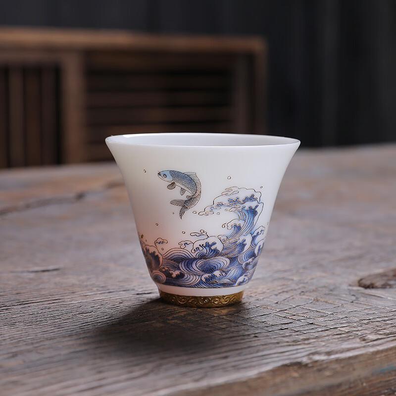 Dehua White Porcelain Teacup - Sea Wave Koi