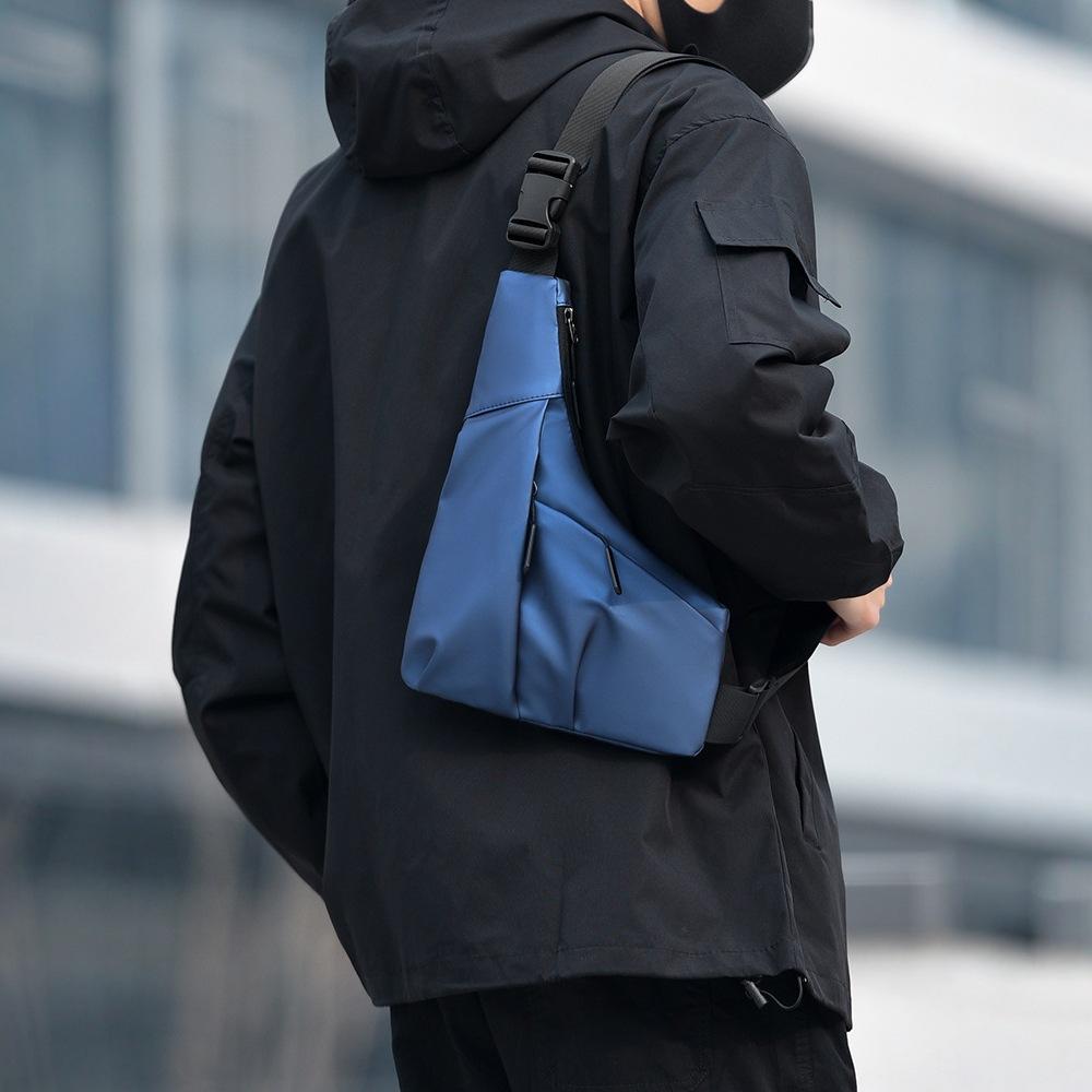 New triangle bag casual men's leather film large capacity messenger bag fashionable outdoor water-proof shoulder bag