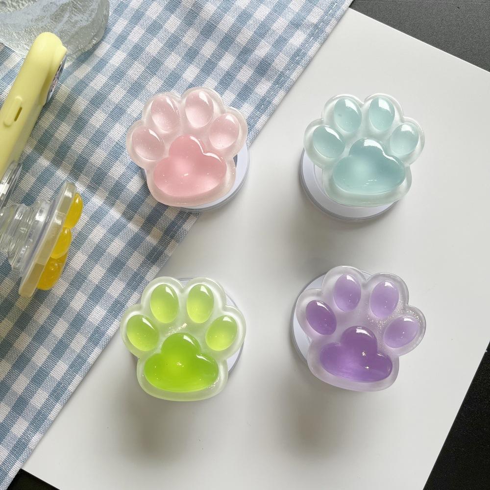 Colorful Glow-in-the-Dark Cat Paw Phone Air Cushion Stand, Magnetic Retractable Lazy Desktop Drama Watching Stand