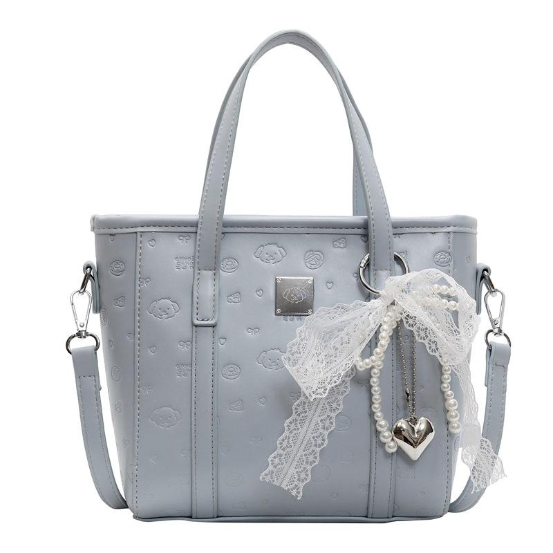 Spring and summer popular niche sweet and cute embossed portable bucket bag Korean version commuter casual versatile messenger bag bag woman