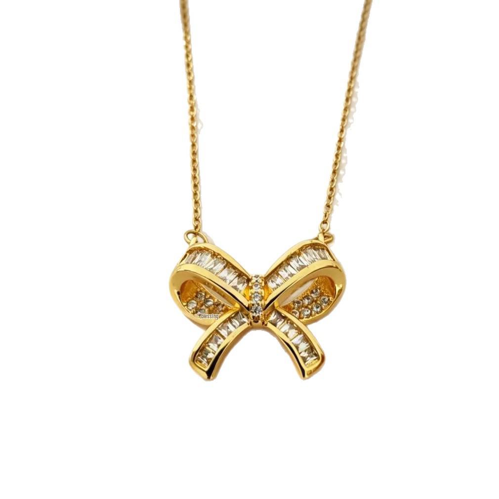 Copper Gold-Plated Bow Knot Pendant Necklace: Elegant & Trendy Accessory for Women.