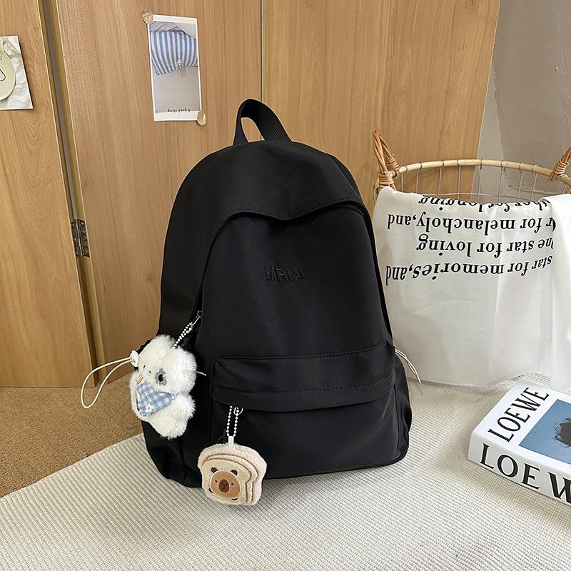 Cream school bag for female junior high school students, high-value niche computer travel backpack, simple and versatile college student backpack