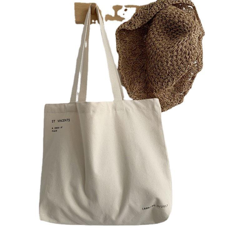 Niche Design, Large Capacity Canvas Bag with Artistic Appeal