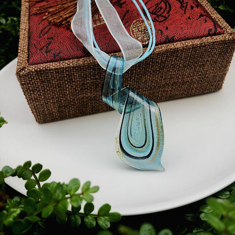 Trendy Blue Glass Ribbon Pendant Necklace & Earring Set - Perfect Seaside Vacation Accessory.