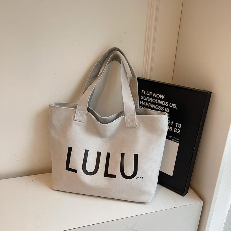 2025 autumn new portable shoulder canvas bag fashionable simple letter trend commuter large capacity shoulder bag