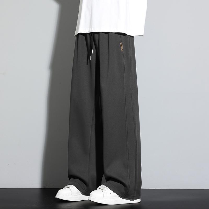 Spodnie dresowe męskie luźne casualowe na wiosnę i jesień z elastycznym pasem i szerokimi nogawkami spodnie proste