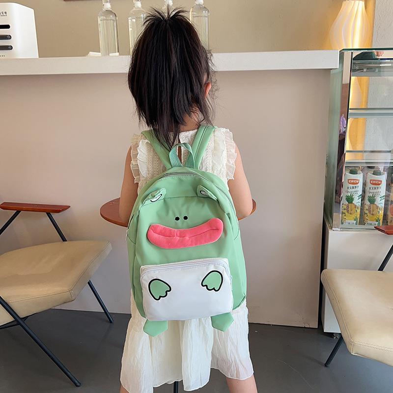 The new Japanese cute little frog backpack is the same for men and women, and the autumn versatile student large-capacity backpack bag.