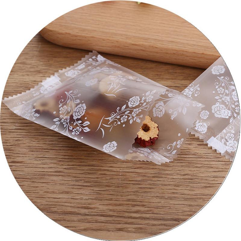 100Pcs Translucent Frosted Rose Flower Pattern Fruit Tea Candy Cookie Machine Sealed Bags Plastic Packaging