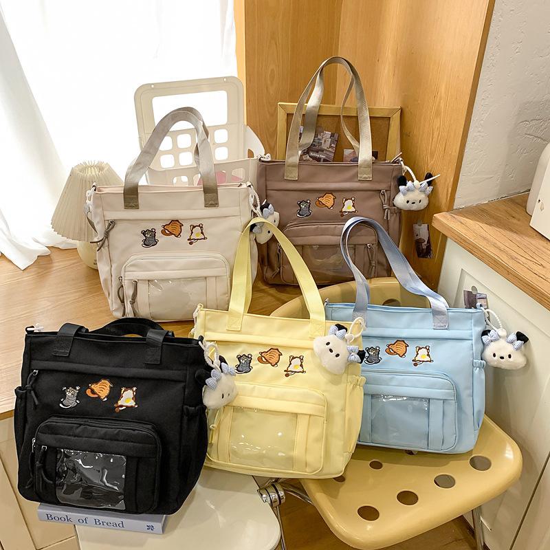 Cute messenger bag women's 2025 new Japanese pain bag large-capacity shoulder bag girl junior high school student portable tote bag