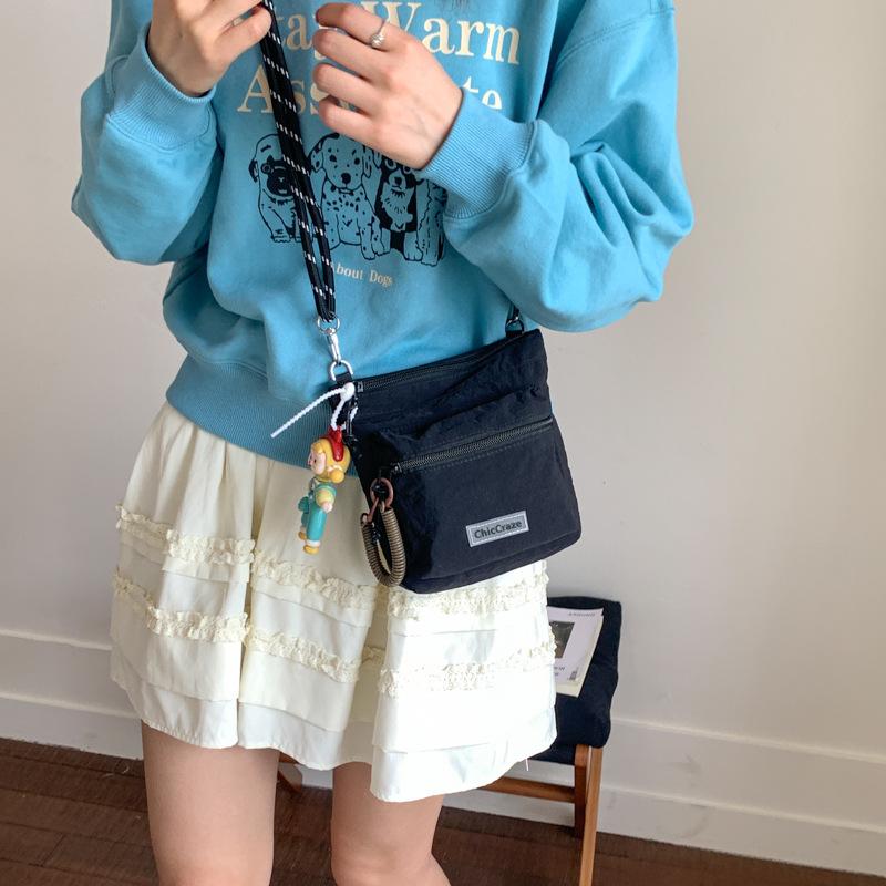 Shoulder bag women's solid color couple outdoor summer new lightweight messenger bag men's and girls outdoor sports small satchel