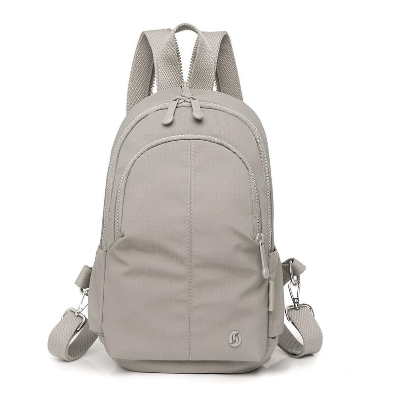 

New retro outdoor mountaineering bag light and casual multi-compartment backpack men s simple travel bag schoolbag women s сірий колір