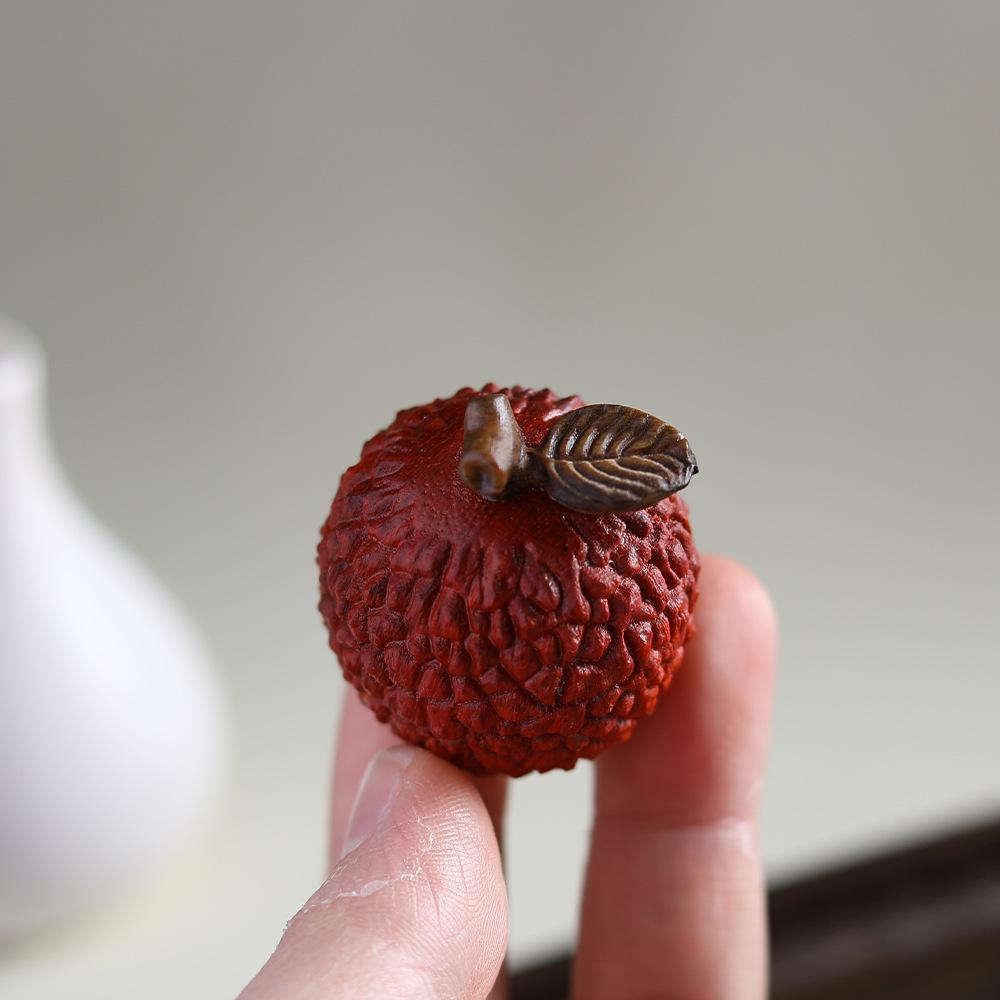 Purple Sandalwood Lychee Wenwan Handheld Ornament: Agarwood Craft for Office Tea Table.