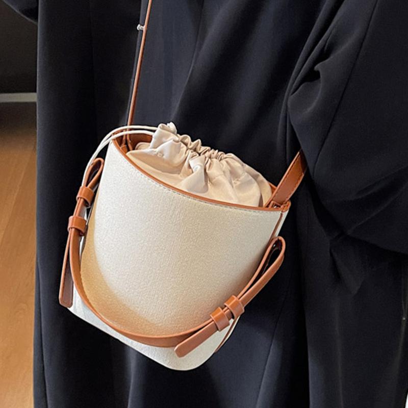 Niche design contrasting color portable bucket bag women's 2025 new casual retro handbag Korean version shoulder messenger bag