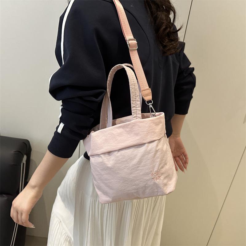 Fresh and sweet girl simple casual going out large capacity solid color spring hand carry shoulder small messenger bag
