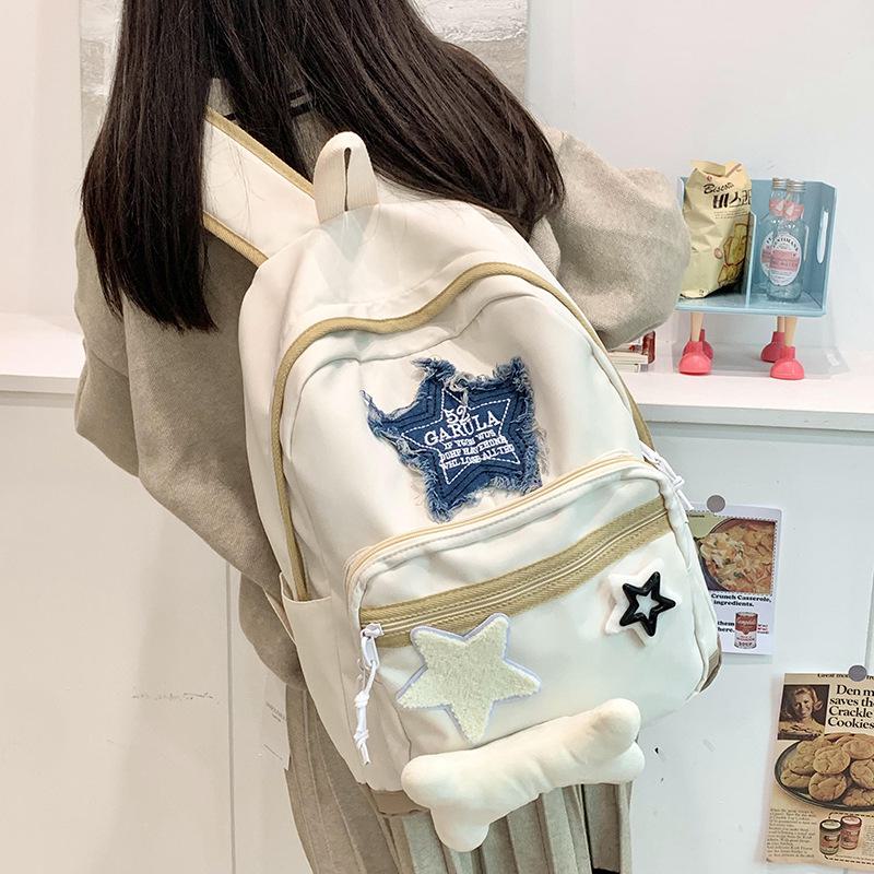 Stylish Star-print School Backpack for Junior High and High School Students. Perfect for Travel with Spacious Compartments.simple, and Trendy Design.