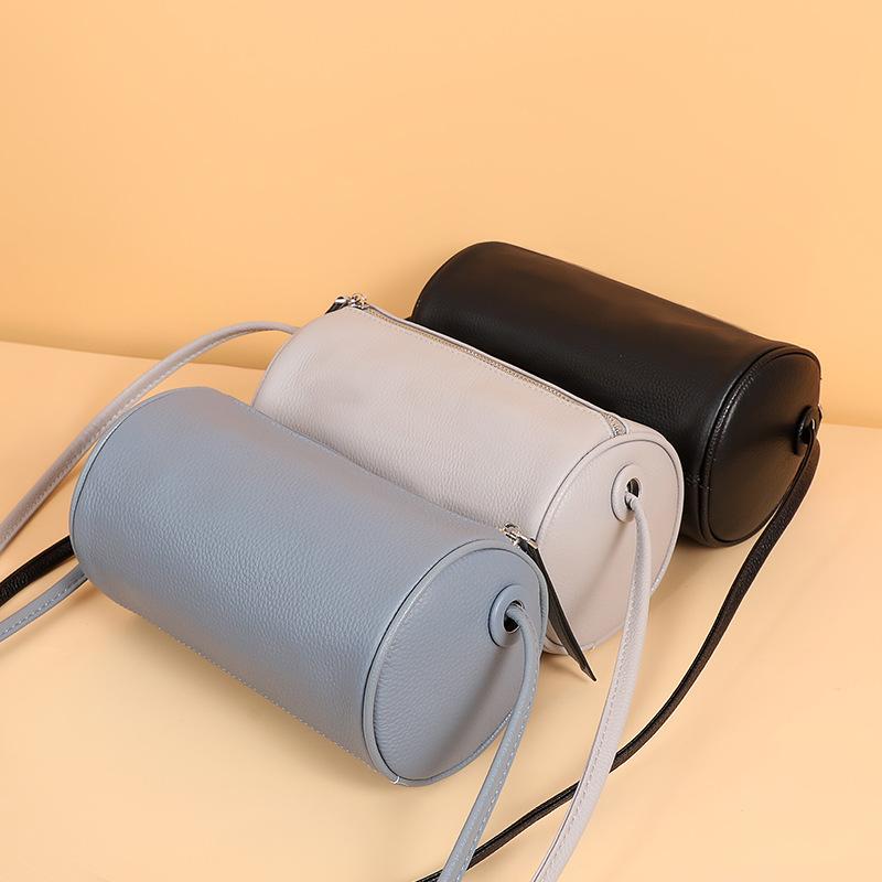 Women's bag real cowhide cylinder bag new niche messenger bag plus