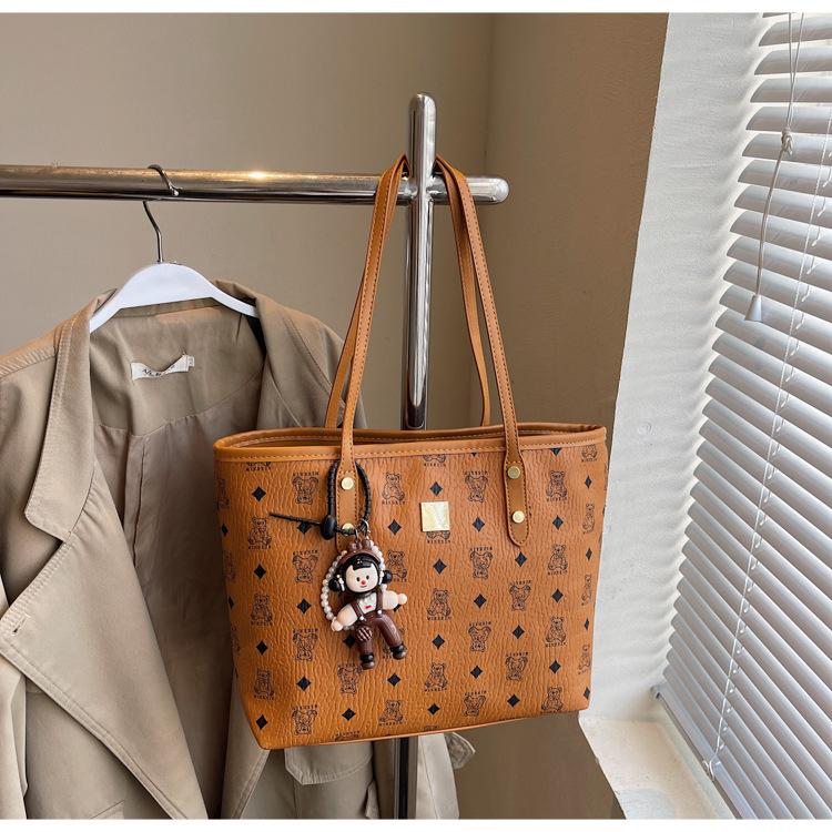 

Casual large-capacity tote bag women s 2025 new temperament printed hand bag college student morning eight commuter women s bag