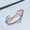 Luxury-lite Plastic Bracelet with Curved Metallic Texture, A Unique Design for Fashionable Jewelry.