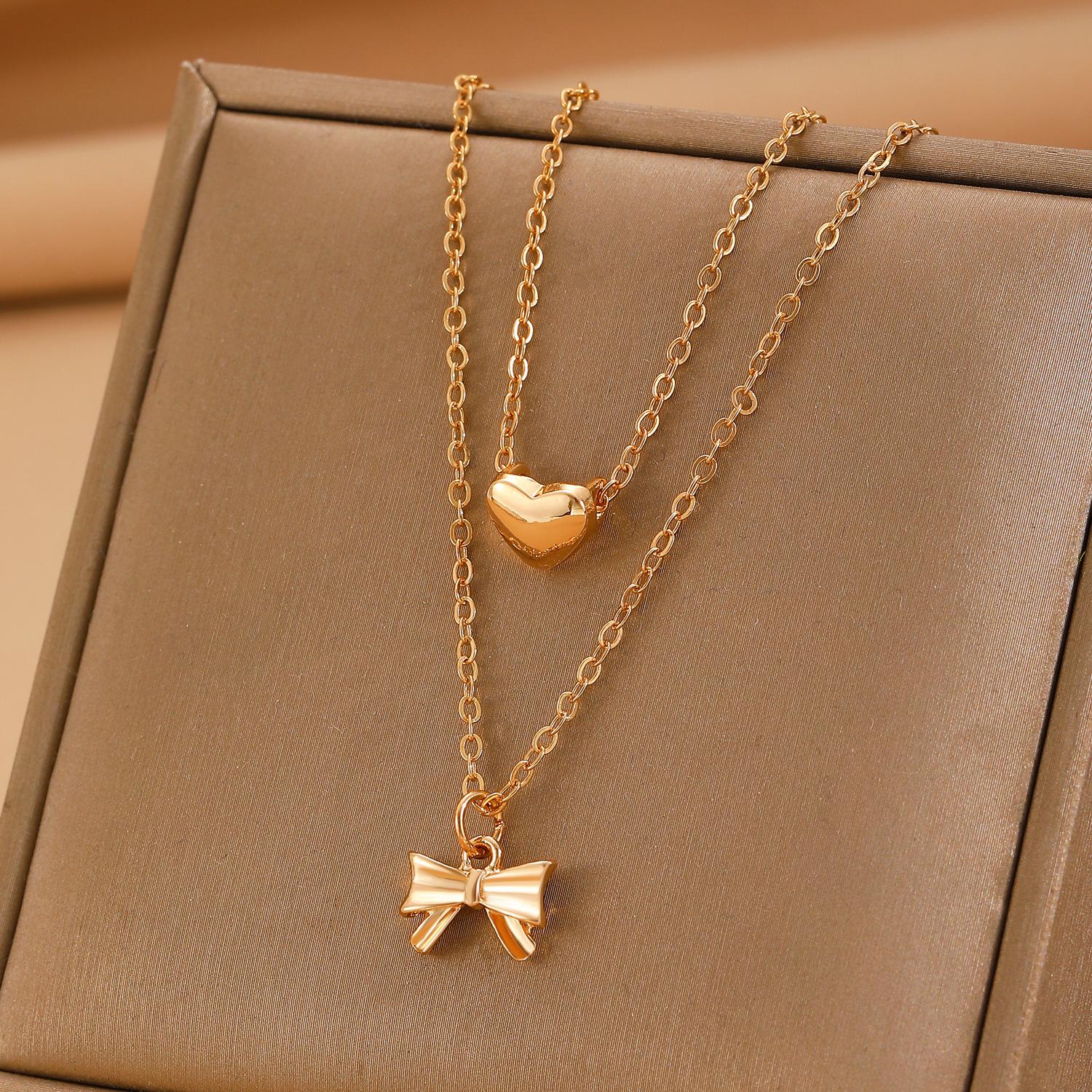 

2025 Princess on the Run Yellow Gold Bow Necklace Long Sweater Chain Love Pendant Tassel Collarbone Chain Women