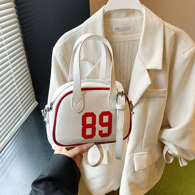 New Women's Niche Design Contrasting Color Bowling Handbag Texture Fashionable Polka Dot Shoulder Women's Bag