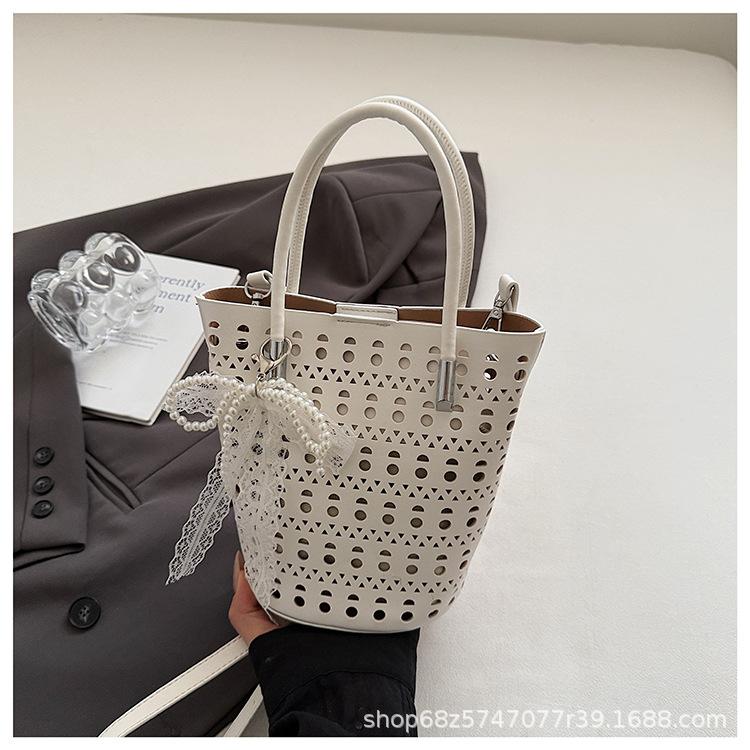 

Bags Portable vegetable baskets Bucket bags 2025 new hollow shoulder mother and child bags Fashion commuter messenger bags
