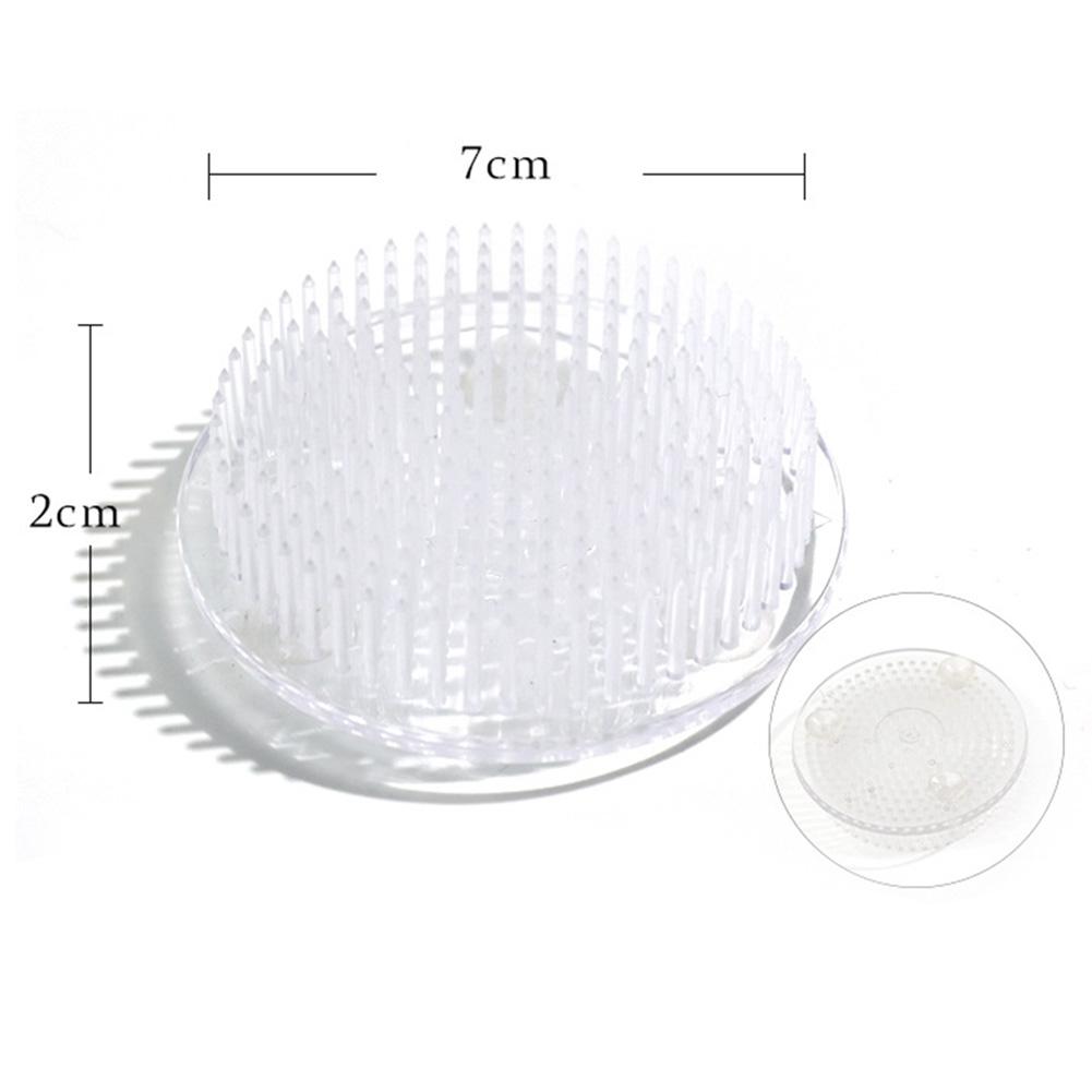 

Spiky Round Floral Frog with Suction Cup Mounting System for Secure Stem Support in Shallow Dish and Bowl Arrangements