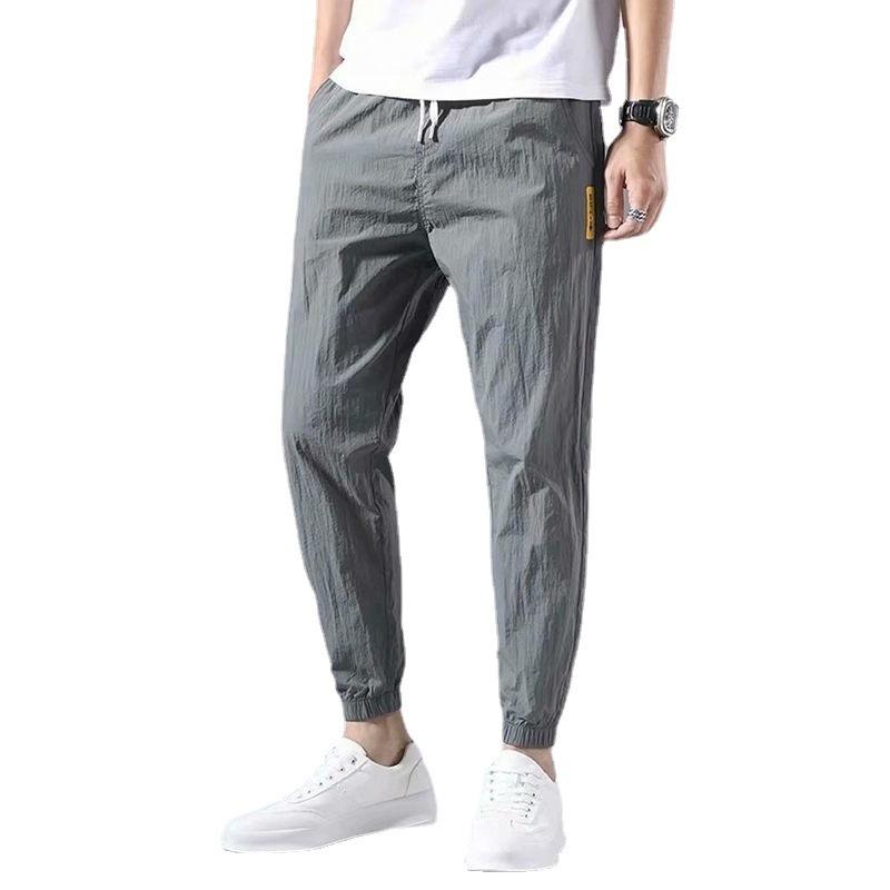 Men's sports casual pants summer trendy brand ice silk thin loose large size nine points tied feet trendy trousers