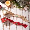 Wire edged decorative ribbons with holiday scallion prints designed for Christmas wreaths floral crafts and packaging use