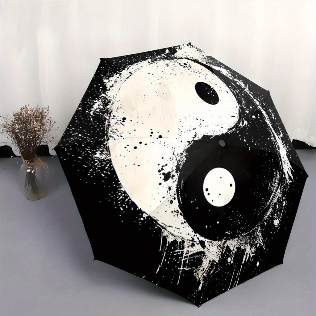 Automatic Folding Umbrella Yin-yang symbol with paint splatter effect. Portable collapsible design, casual outdoor accessory,
