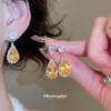 Super flash zircon water drop pendant, stud earrings, necklace, light luxury high-end jewelry, retro court style jewelry set wholesale.