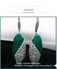 Jade Angel Thai Silver 925 Sterling Earrings with Synthetic Garnet and Green Agate Cat's Eye Dangle Design.