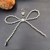 Portachiavi con Ciondolo a Forma di Fiocco d'Amore Placcato Argento per Telefoni - Raffinato Piccolo Accessorio Regalo