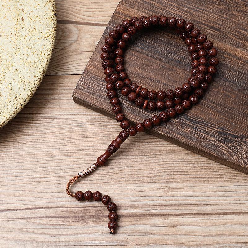 Ručně vyráběný 99-korálkový růženec Tasbih s imitací dřevěné kresby ze Saúdské Arábie